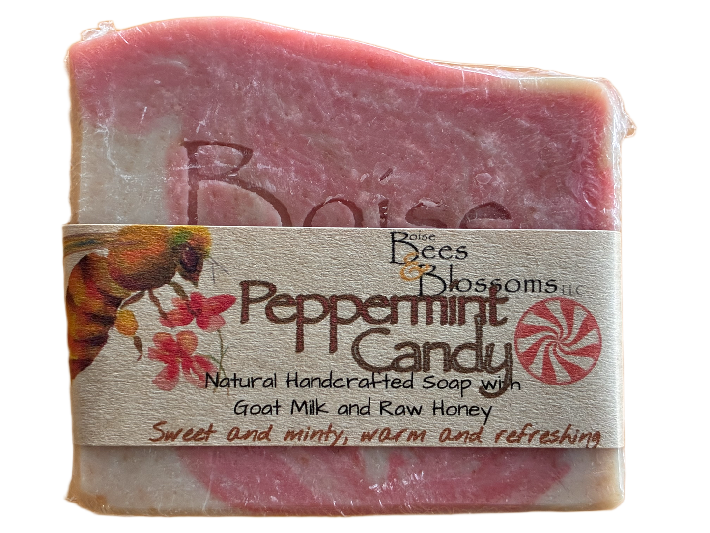 Bar of peppermint candy soap with a label on a white background